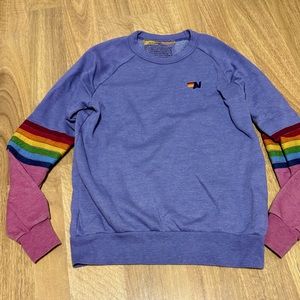 Aviator nation purple and pink sweatshirt with rainbow stripes on the sleeves